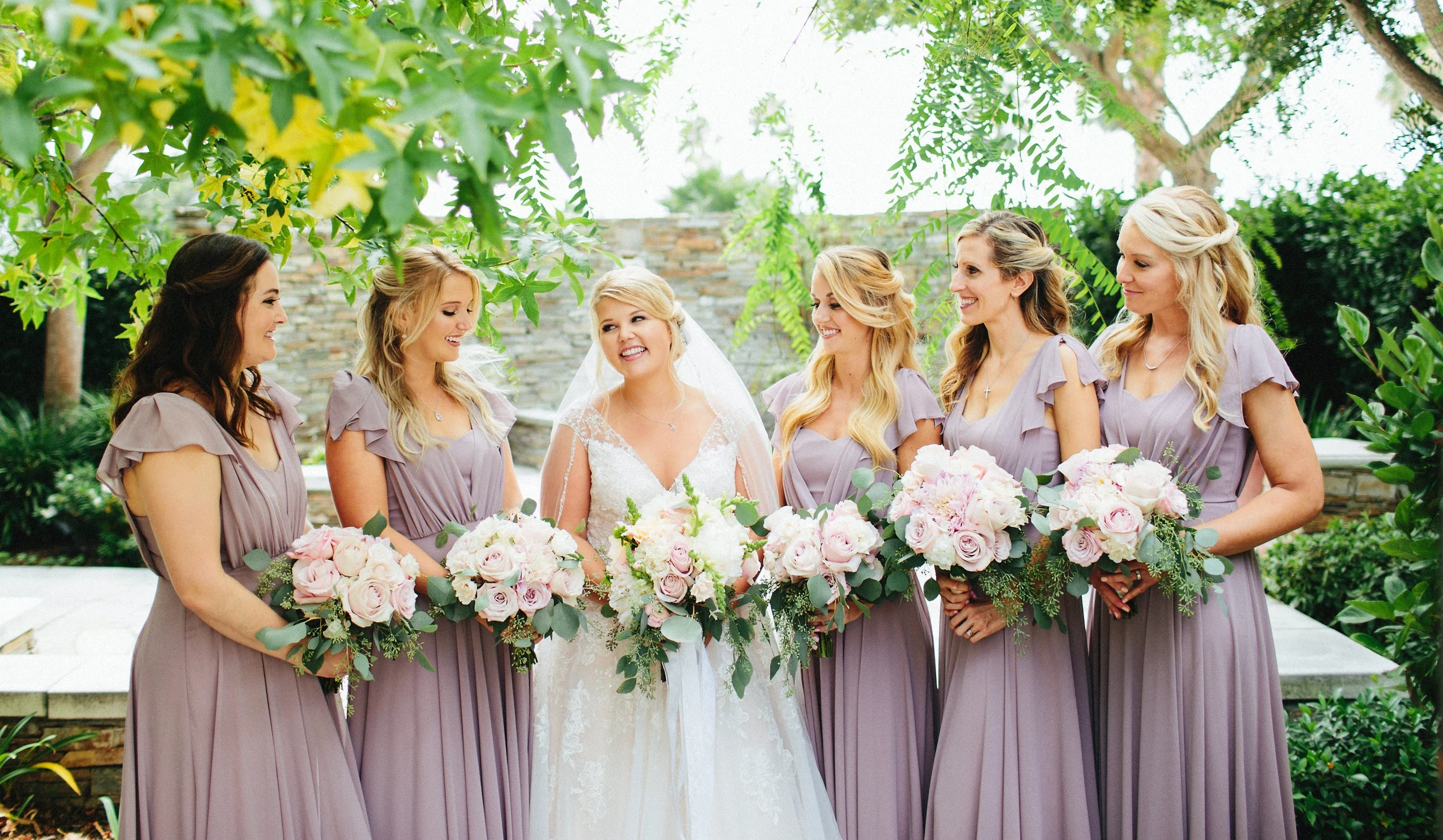 My finished wedding-day makeup and hair on a bride and her bridal party.
