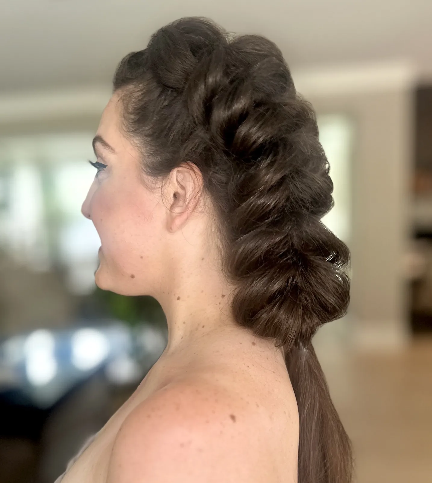 My bubble braid hairstyle on a client going to a music festival, viewed from the side.