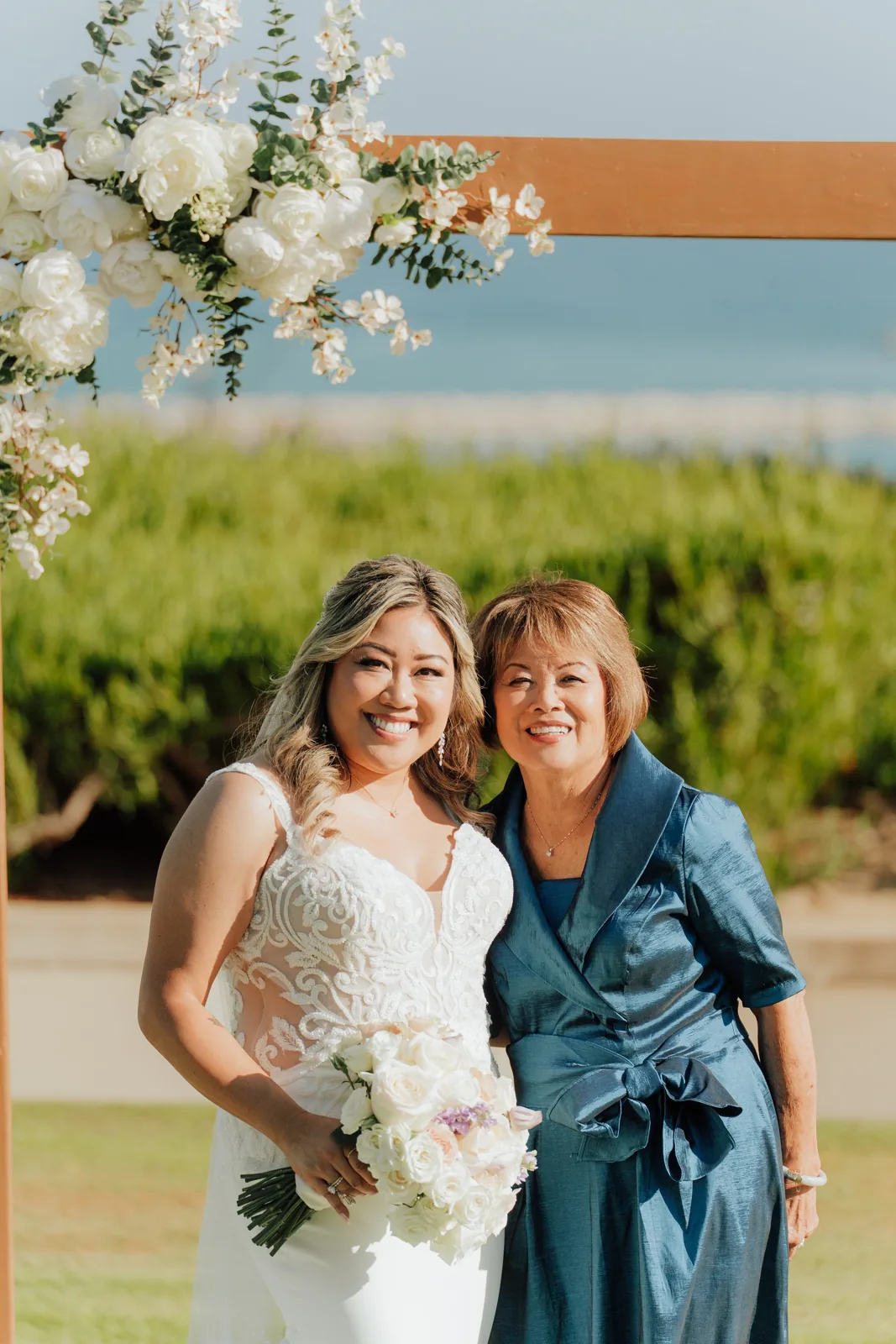 Tamara and her mother standing together at the wedding.